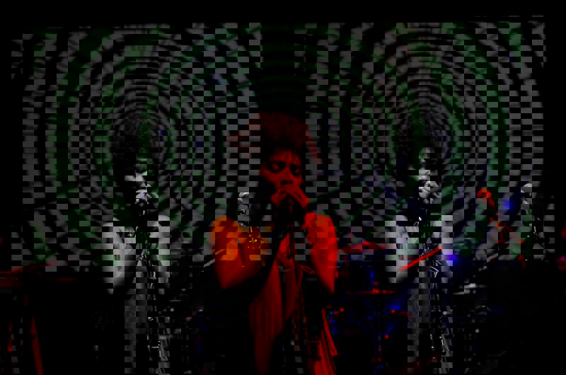 woman singing on stage